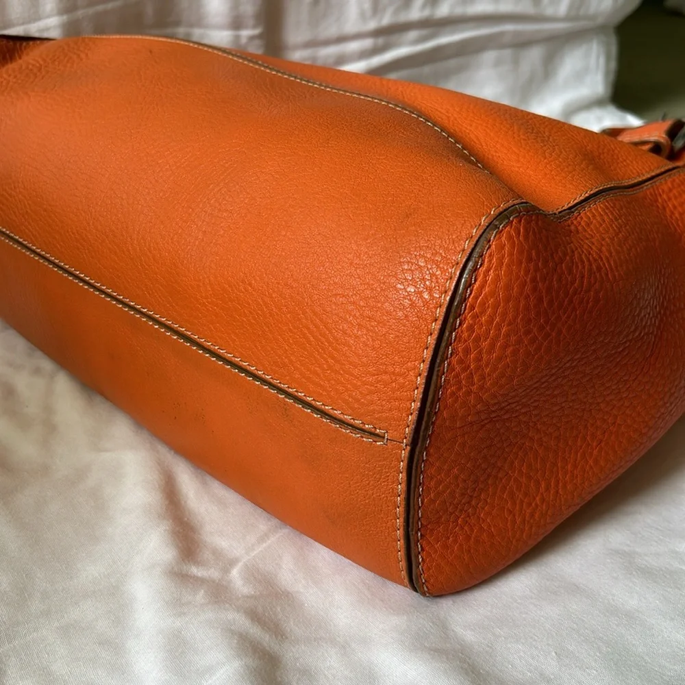 Large leather Cole Haan orange shoulder bag with silver hardware buckles. - Picture 9 of 16